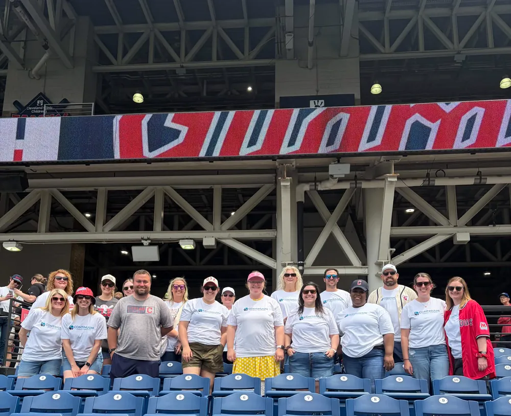 The Continuum team in matching shirts at an Atlanta Braves game